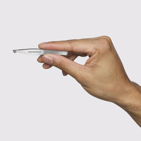 Tweezerman stainless steel tweezer tips aligned, showing accuracy for hair removal.