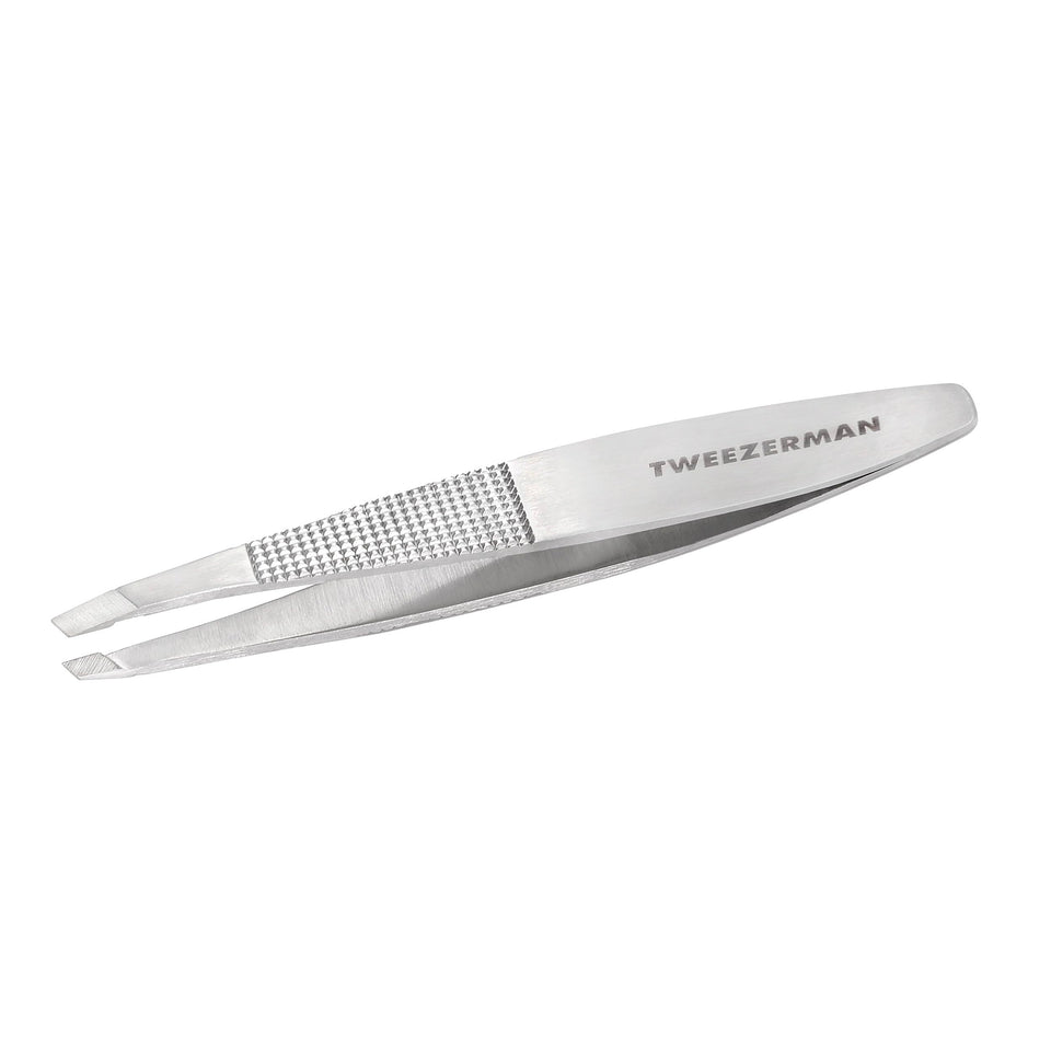 Tweezerman Wide Grip Slant Tweezer close-up tips for precise brow shaping.