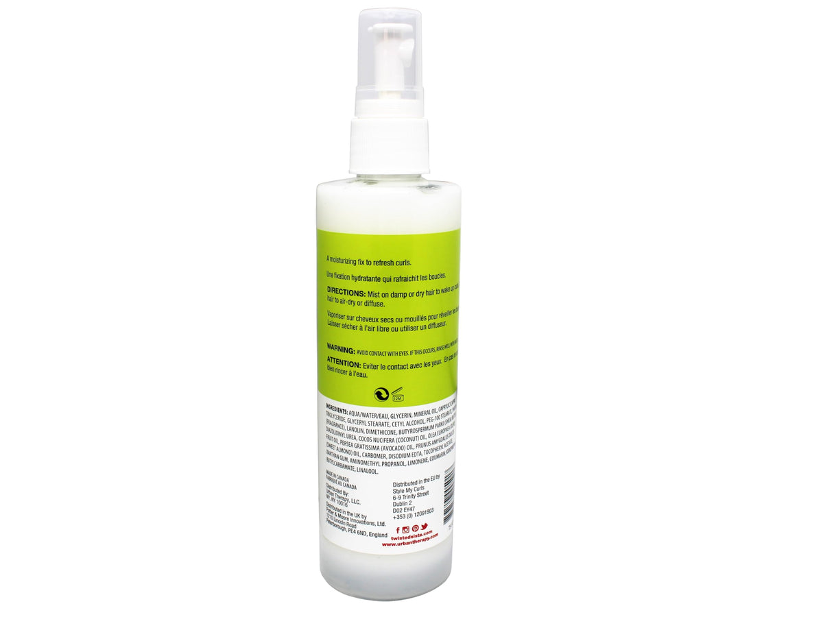 Close-up of the mist being dispensed from Twisted Sista Curl Spray.
