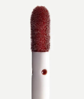 Typology lip oil with glossy, non-sticky finish for a smooth shine.