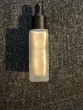 Typology Paris Glow Drops on skin demonstrating natural, blendable glow