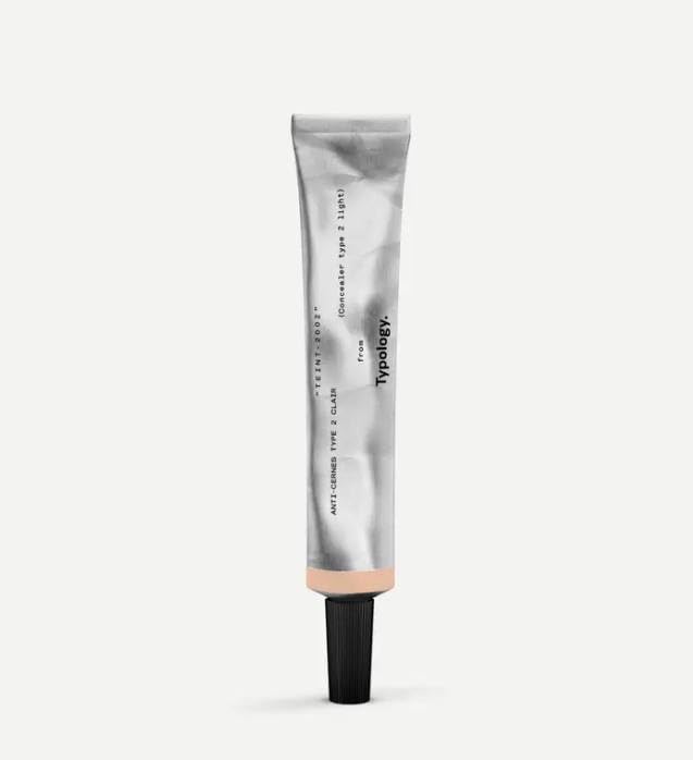 Typology tinted concealer Type 2 in light bottle provides coverage for under-eye areas.