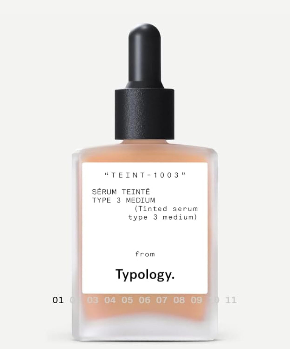 Typology tinted serum bottle close-up showing vitamin C for radiant skin