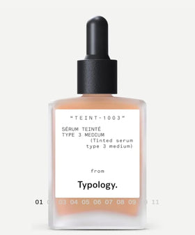 Typology tinted serum bottle close-up showing vitamin C for radiant skin