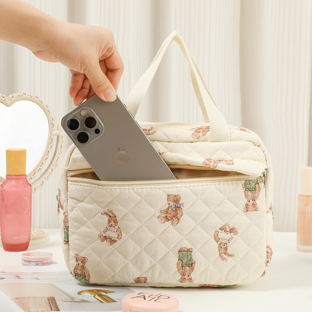 Top handle on the Coquette makeup bag for easy grab-and-go
