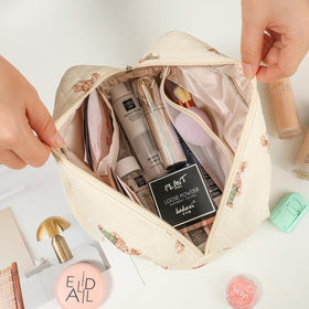 Coquette travel-sized makeup bag that fits in luggage or handbag