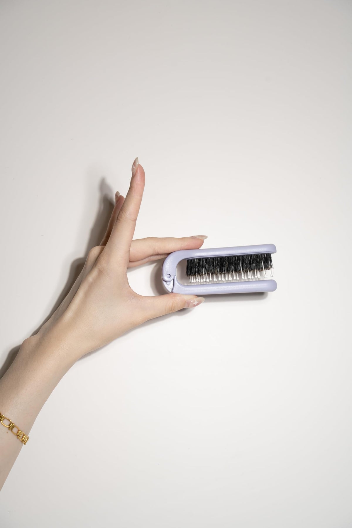 Uffy MiniPop lightweight travel brush ideal for backpacks, gym bags, and school