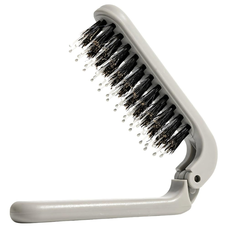 Uffy MiniPop folded travel brush in pocket for on-the-go touch-ups.
