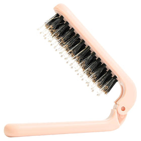 Uffy MiniPop travel brush folded for ultra-portable on-the-go touch-ups