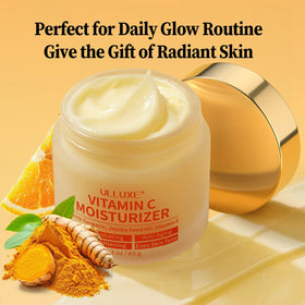 Closeup of ulluxe turmeric-infused Vitamin C cream on skin for radiance