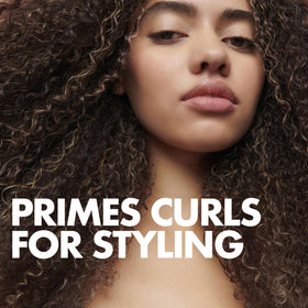 Umberto Giannini Curl Jelly dispensing bottle illustrating easy application for quick styling.