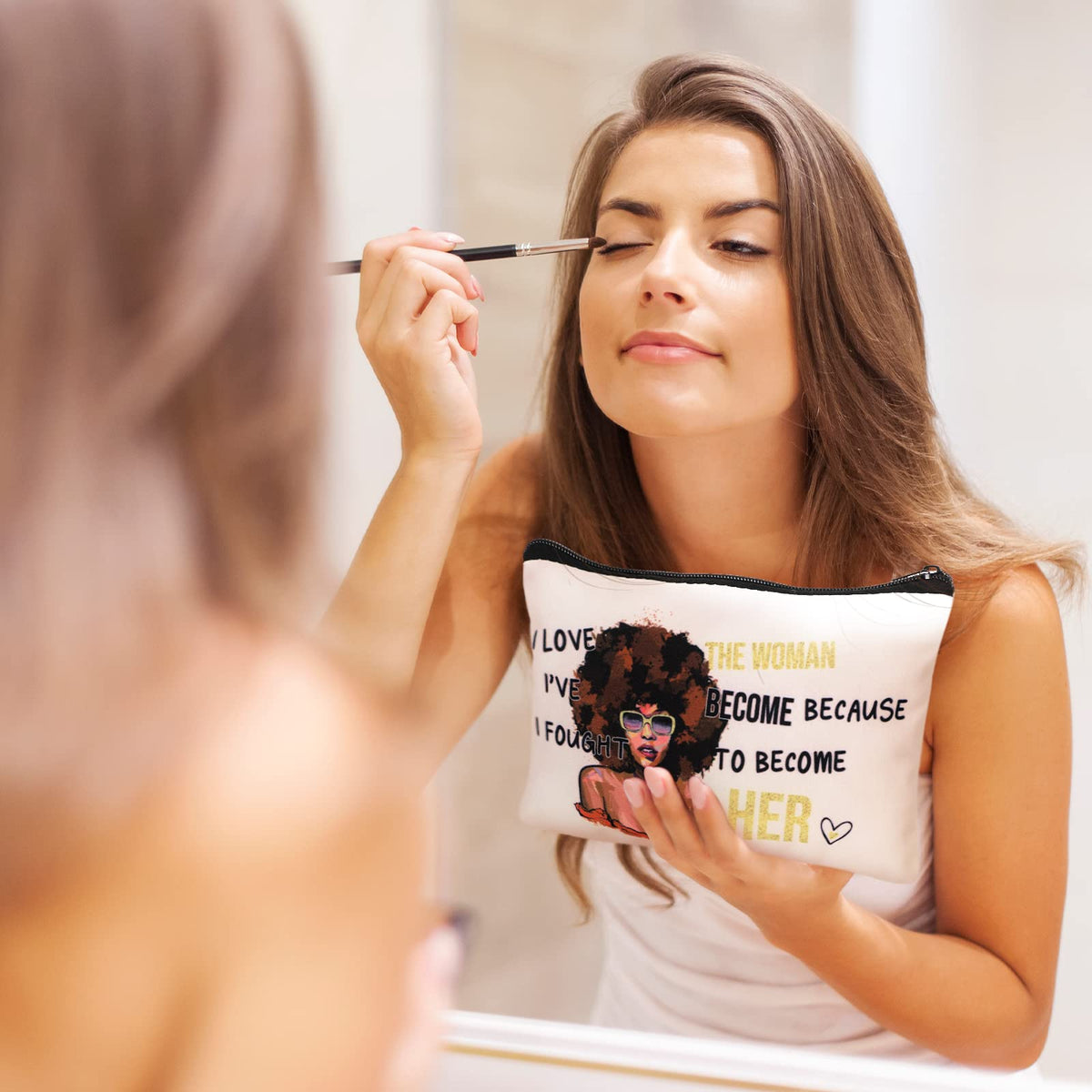 Umigy melanin art cosmetic pouch showcases Afro-inspired design.