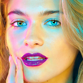UNICORN SNOT Quiet Riot creamy, weightless texture on lips.