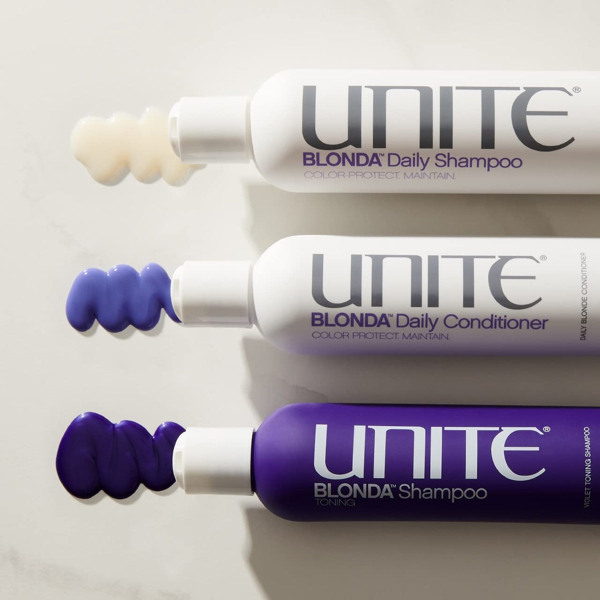 UNITE Blonda Daily Purple Conditioner color-protection on highlighted strands.