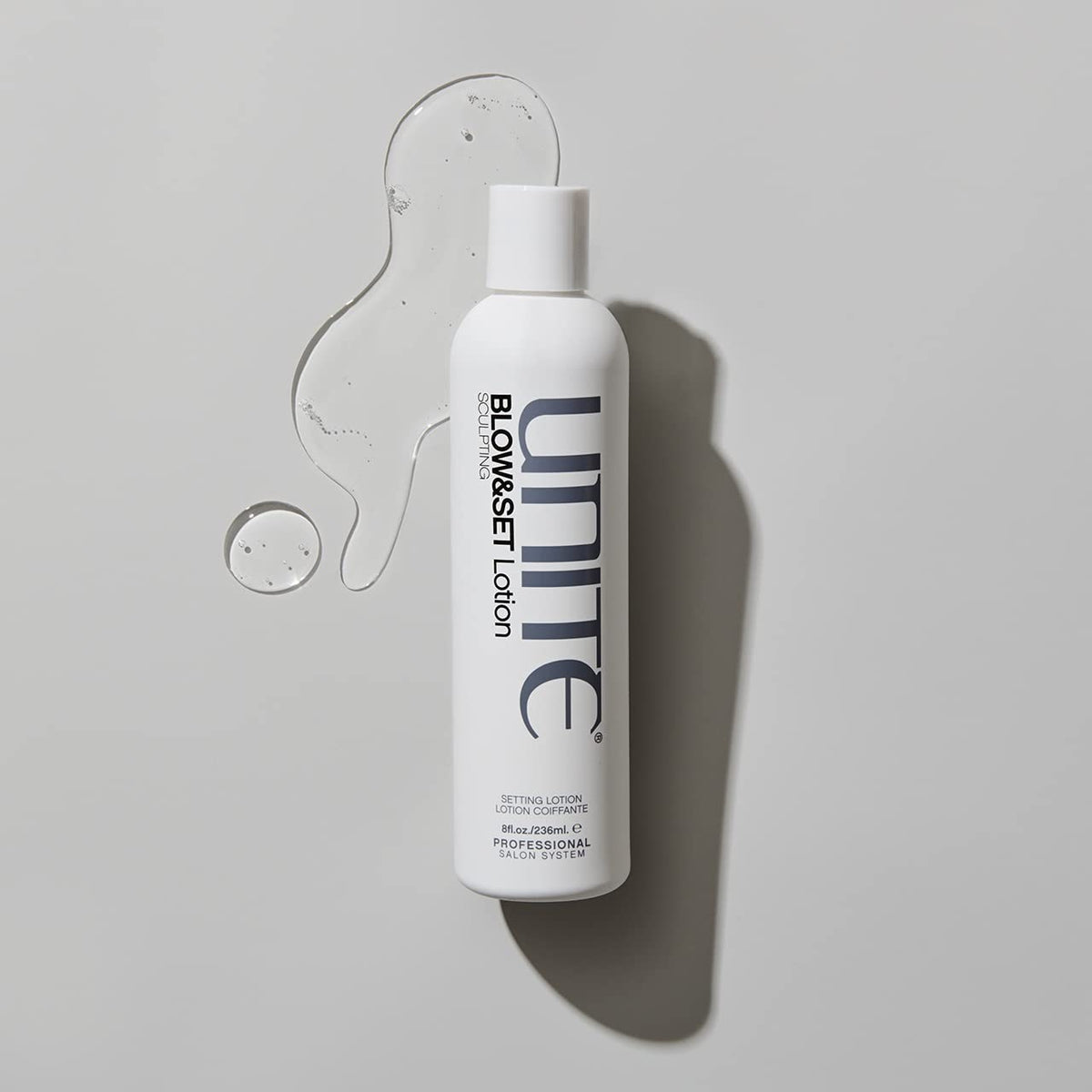 Model with beach waves enhanced by UNITE BLOW&SET lotion