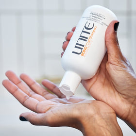 UNITE BOING Curl Shampoo bottle on sink illustrates a curl-safe, sulfate-free routine.