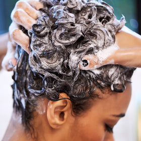 UNITE BOING Curl Shampoo coconut-extract close-up emphasizes nourishment without weighing down curls.