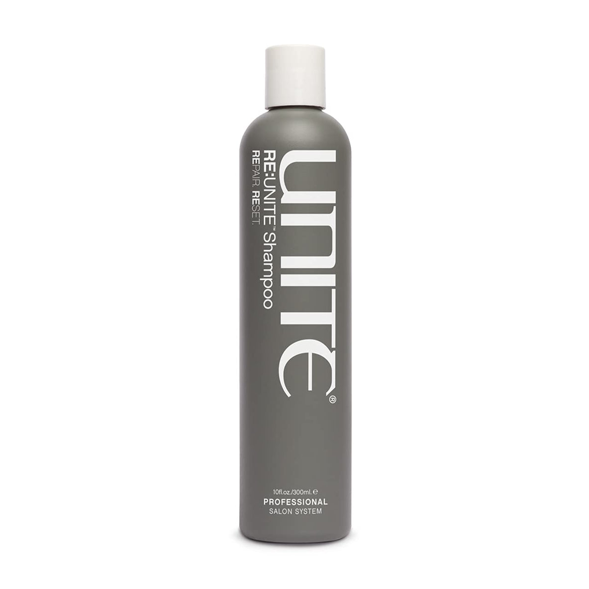 UNITE RE:UNITE Shampoo bottle on a vanity, ready to refresh dry hair.