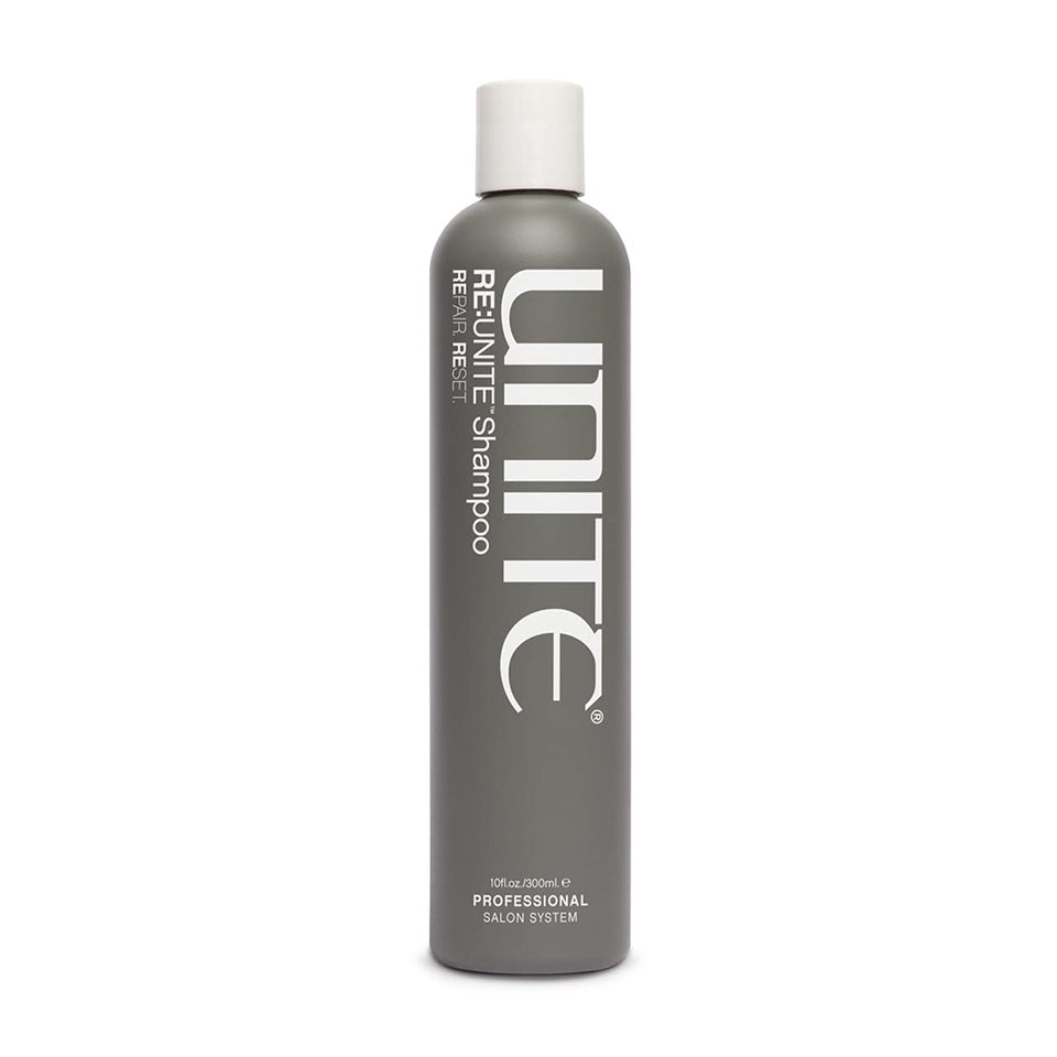 UNITE RE:UNITE Shampoo bottle on a vanity, ready to refresh dry hair.