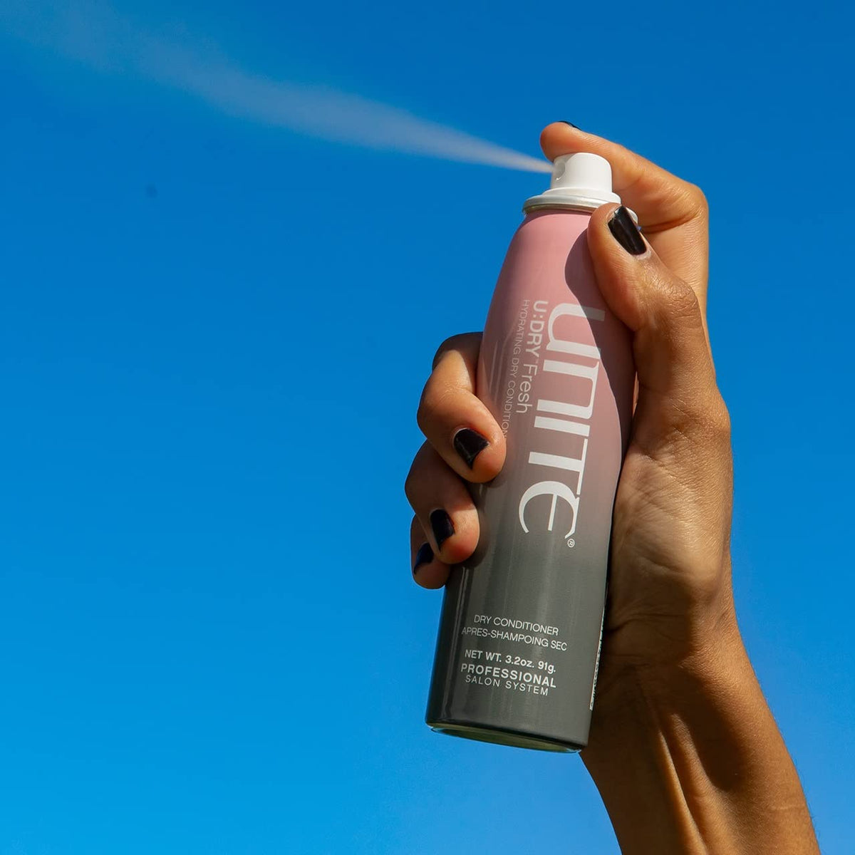 UNITE U:DRY Fresh spray action demonstrating mid-length frizz control and shine