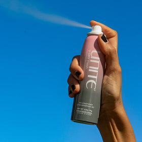 UNITE U:DRY Fresh spray action demonstrating mid-length frizz control and shine