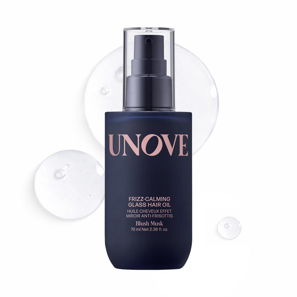 UNOVE Frizz-Calming Glass Hair Oil bottle closeup showing glass-like shine for sleek results