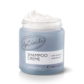 UPCIRCLE Shampoo Crème with Rosemary Oil and Pink Berry bottle for a gentle cleanse.