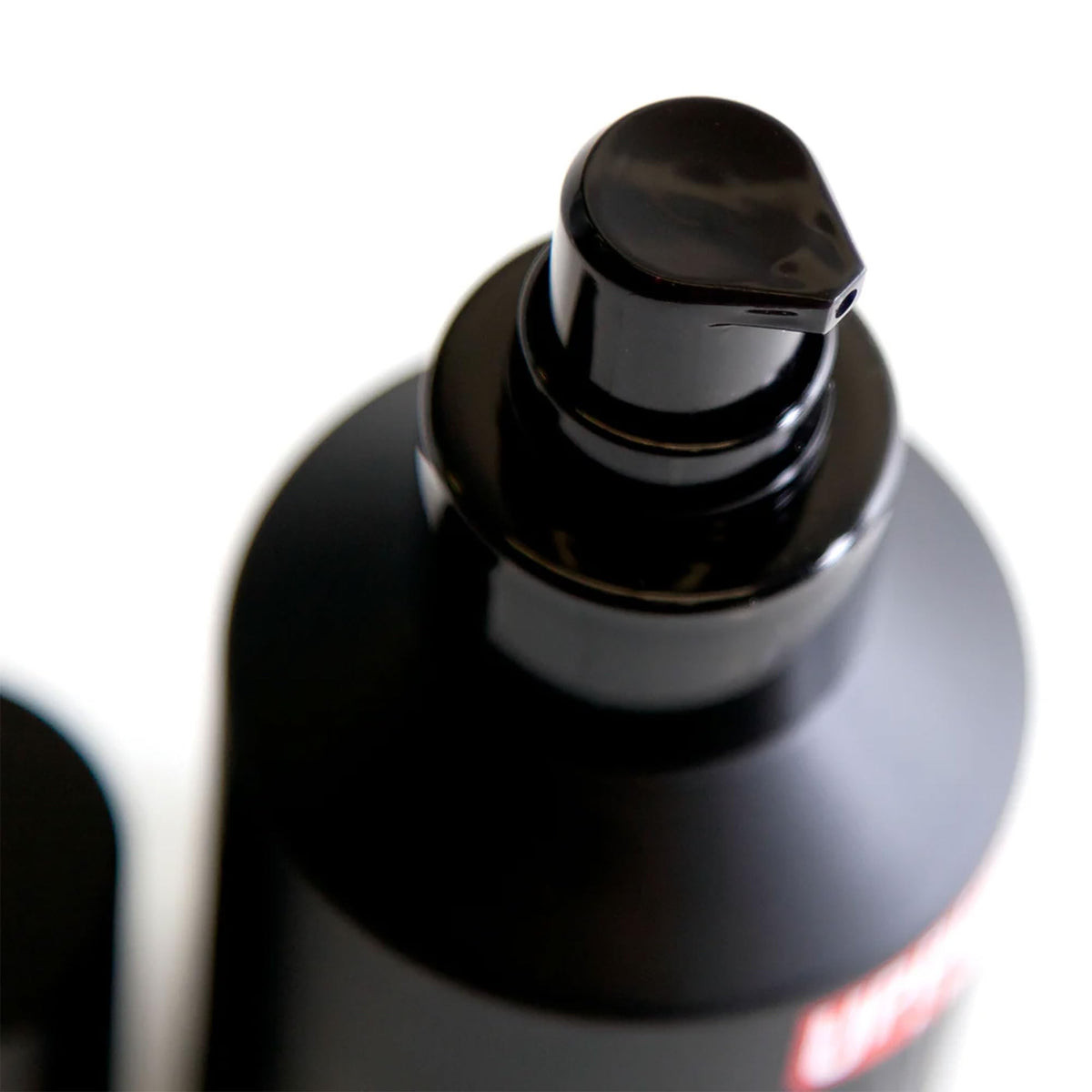 Close-up of balm being applied through beard for even distribution by Uppercut Deluxe.