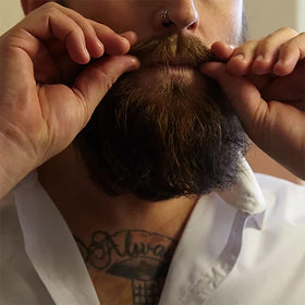 Uppercut Deluxe beard balm packaging for a clean, masculine look.