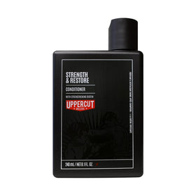Uppercut Deluxe Strength & Restore bottle front, biotin and caffeine for fuller-looking hair