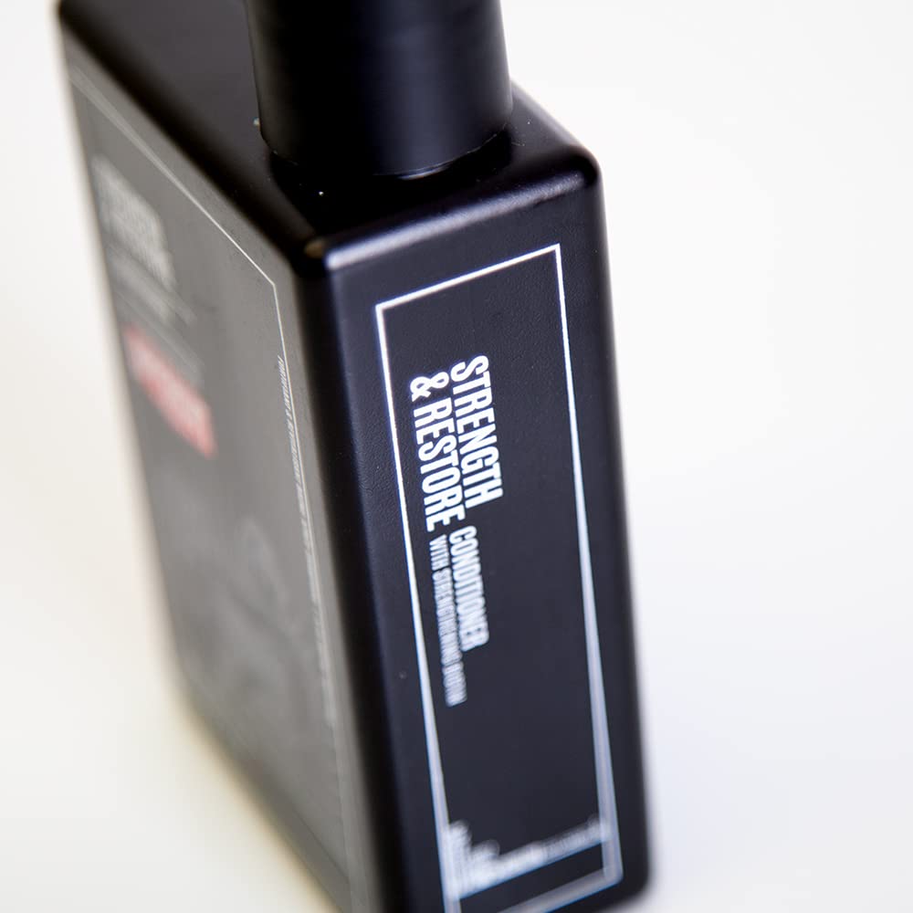 Uppercut Deluxe Strength & Restore dispensing pump in use on sink