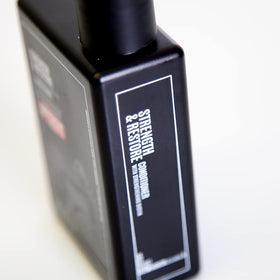 Uppercut Deluxe Strength & Restore dispensing pump in use on sink