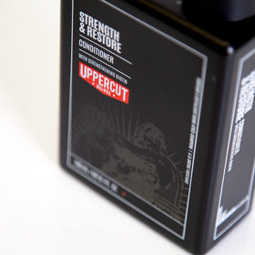 Uppercut Deluxe Strength & Restore label close-up highlighting lightweight daily conditioner