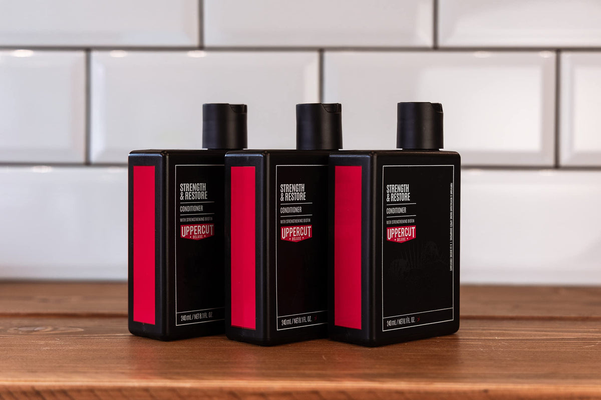 Uppercut Deluxe Strength & Restore packaging and brand logo