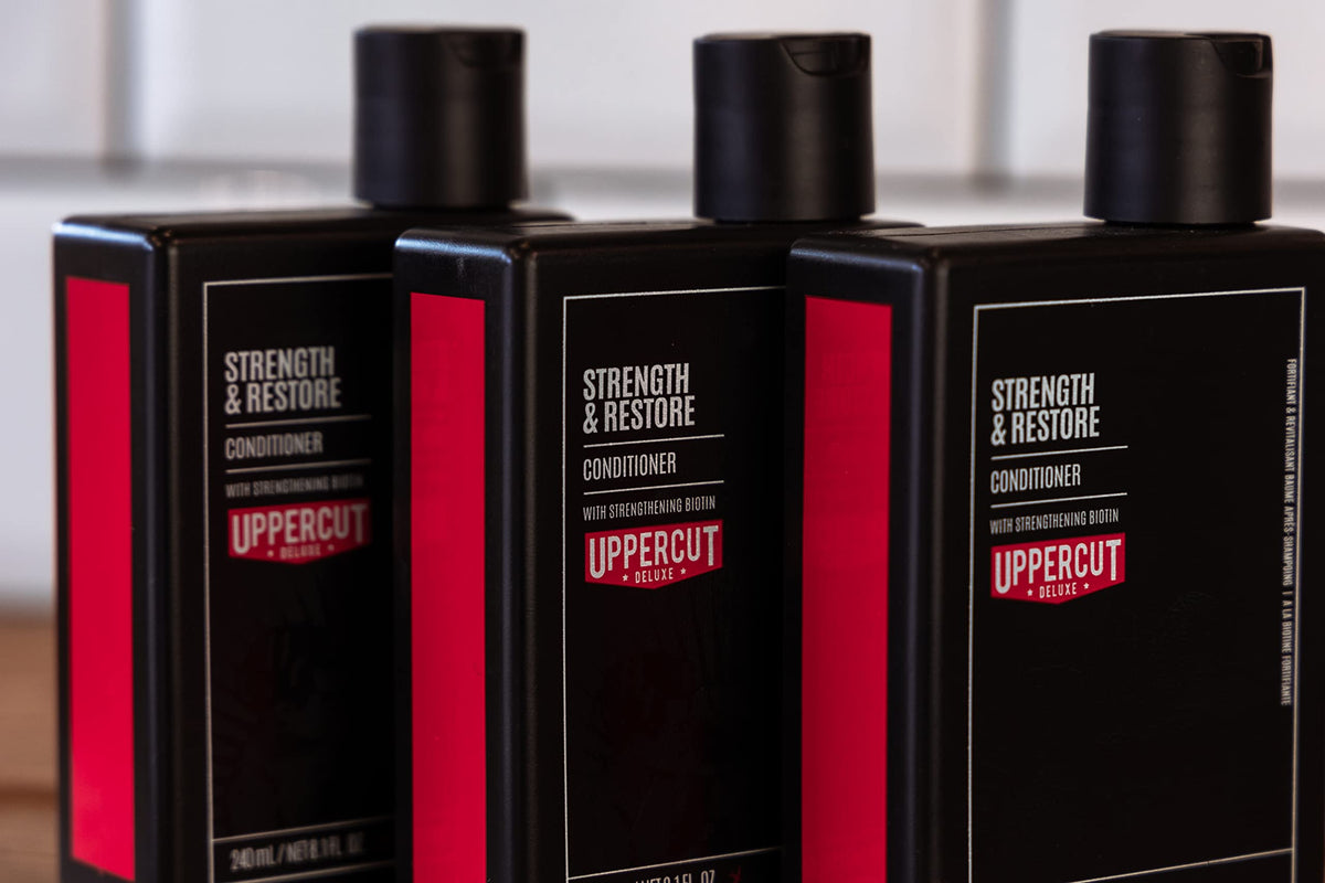 Uppercut Deluxe Strength & Restore conditioner texture close-up on hair