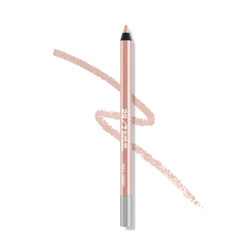 Urban Decay Space Cowboy eyeliner close-up showing peach shimmer and silver sparkle.