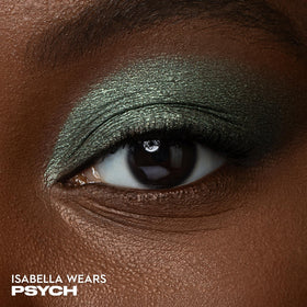 Urban Decay Psych shade swatch on skin showing rich color payoff and smooth blend