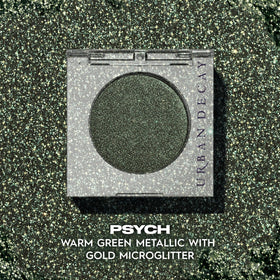 Close-up of warm green metallic finish catching light with subtle gold sparkles