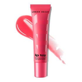 Urban Decay Lip Toy Fresita bottle close-up for a glossy pink finish.