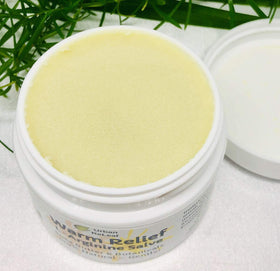 Applying Urban ReLeaf Warm Relief Salve to the palm for gentle warmth
