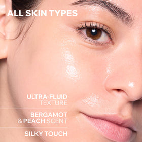 Texture of Uriage glow water essence spreading on the skin