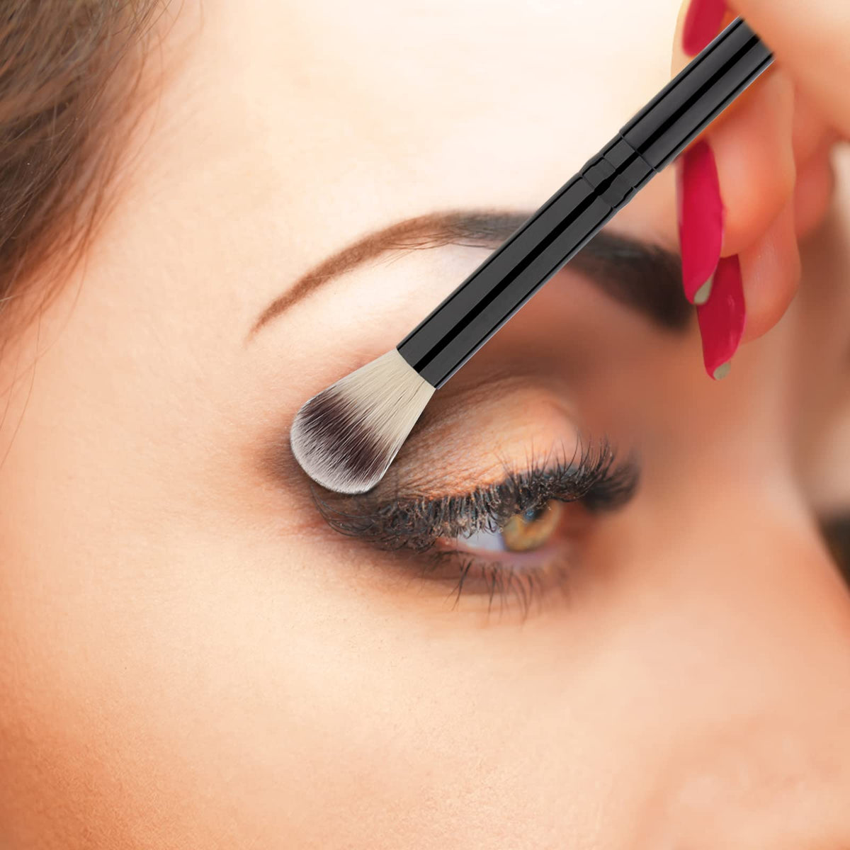 Close-up of Urtlia lash cleansing brush showing fluffy bristles for delicate lashes.