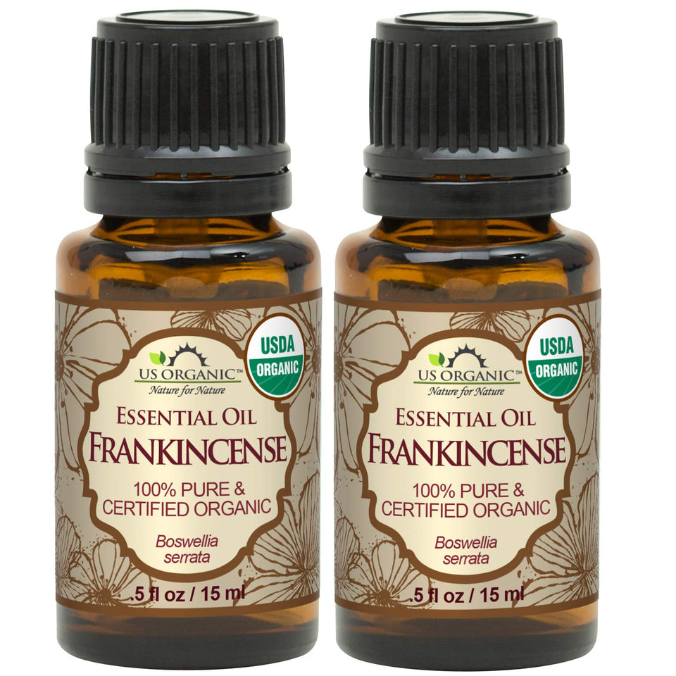 US Organic frankincense essential oil bottle pour for a warm diffused aroma.