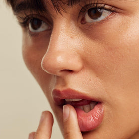 UTU Hydrating Sun Balm applied to lips for hydration and protection.