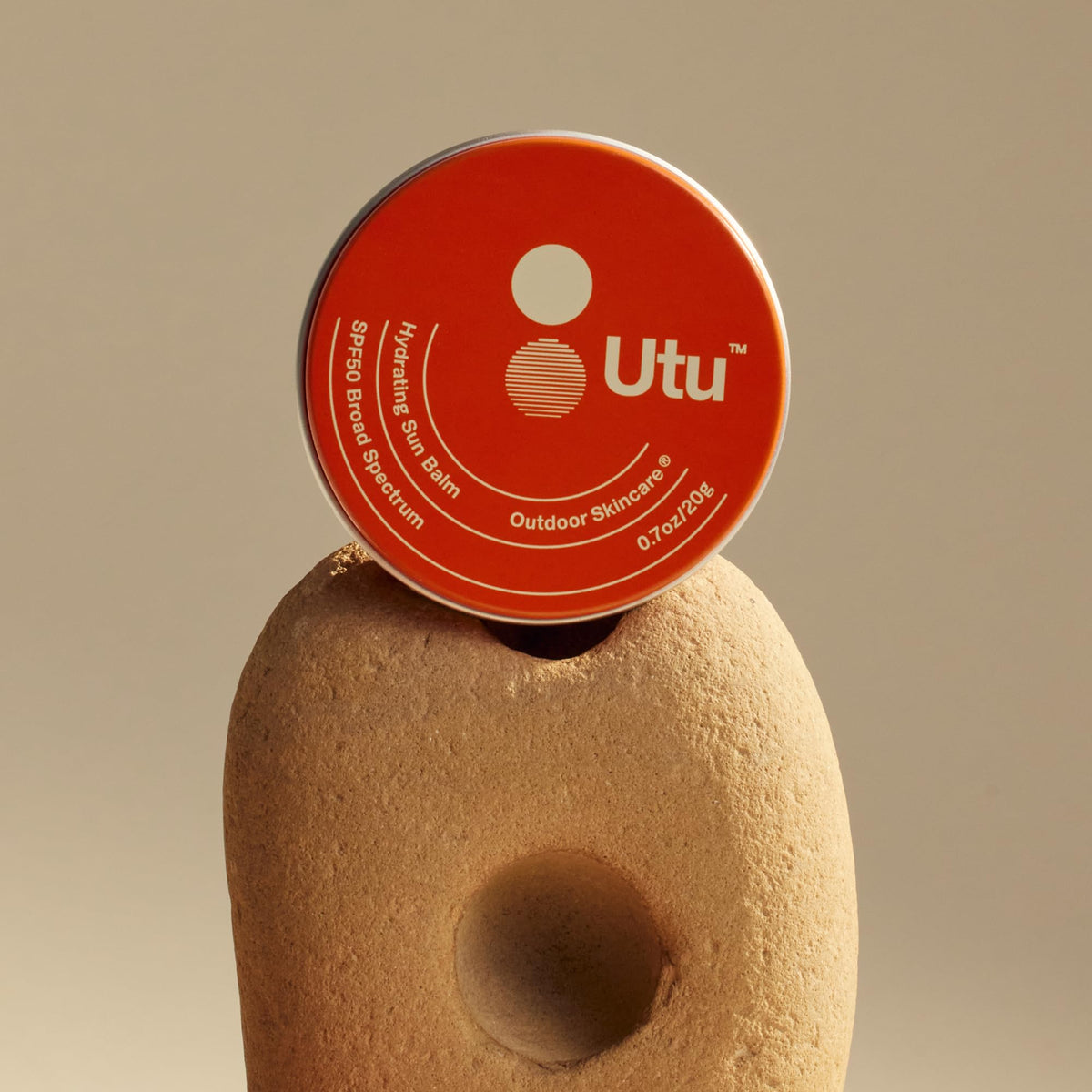 UTU Hydrating Sun Balm on forearm demonstrating sun protection in outdoor use.