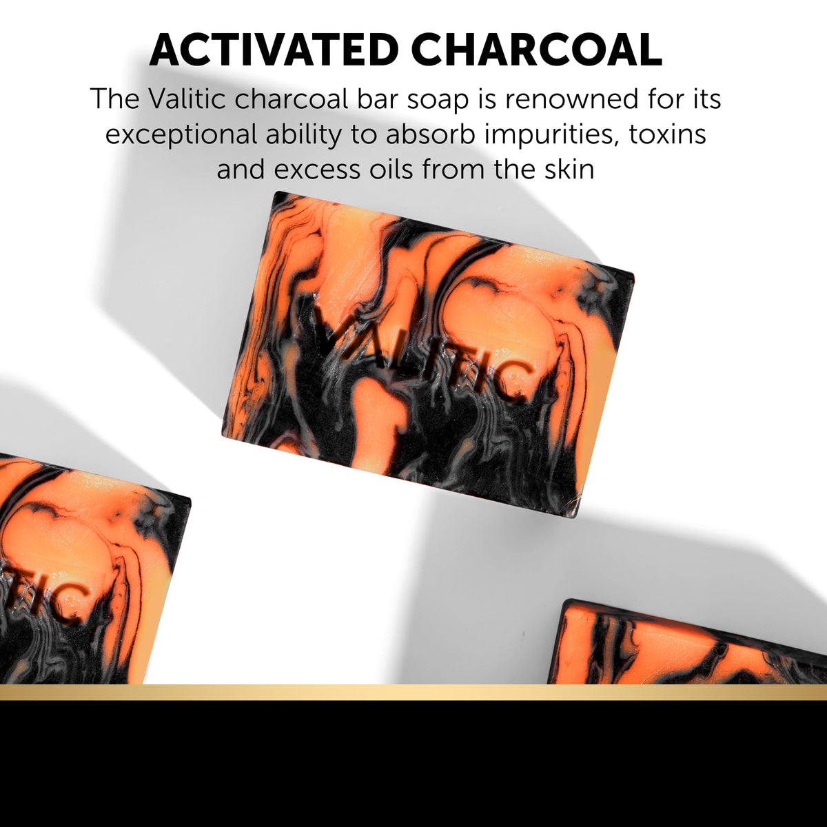 VALITIC charcoal kojic turmeric bar slice reveals textured surface.