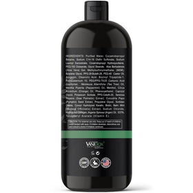 Vanidox Tea Tree Shampoo bottle on sink, suggesting healthier-looking hair.