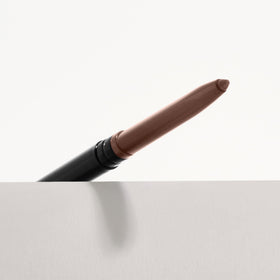 Applying VASANTI Kajal Waterline Eyeliner Hazel Brown on the lower lid with precise control