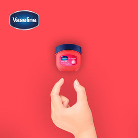 Vaseline Lip Therapy Rosy Lips jar on skin illustrating moisture sealing.