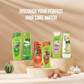 Vatika Naturals bottle assembly on shelf conveys accessible, everyday hair care routine.